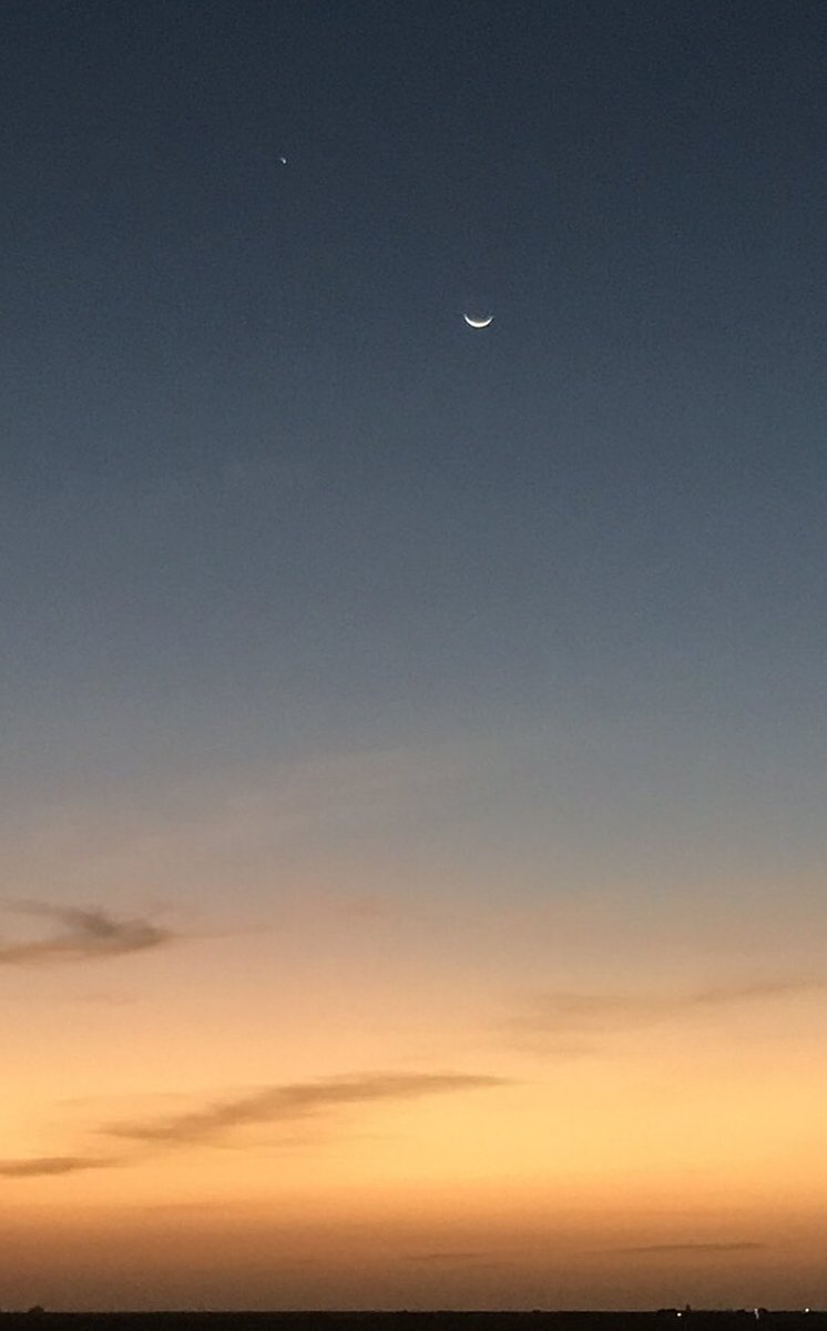 The new moon, and above it to the left Jupiter