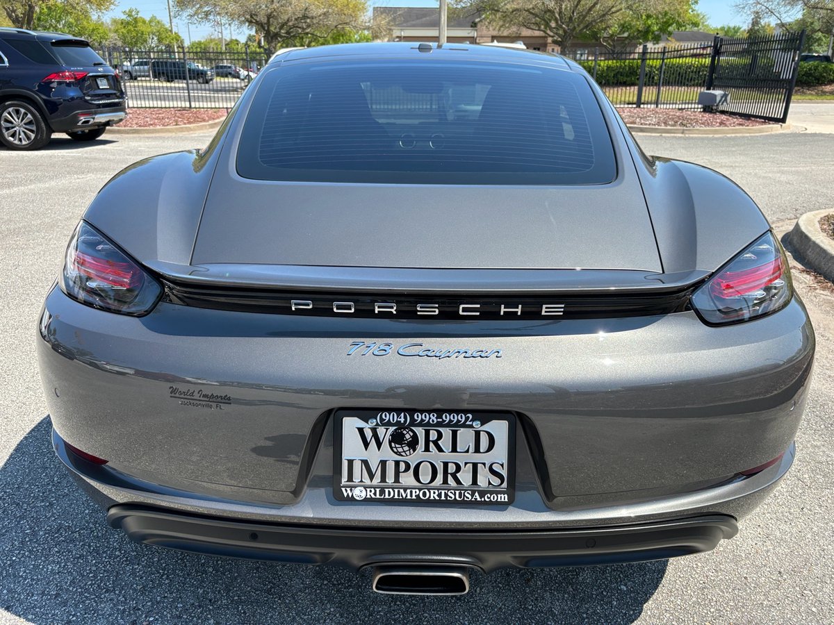 Stop by World Imports USA to see this Agate Grey 2018 Porsche 718 Cayman with turbocharged flat-four, black leather interior, and just 41k miles on the odometer that was just traded in at the dealership! bit.ly/3VOHKxd