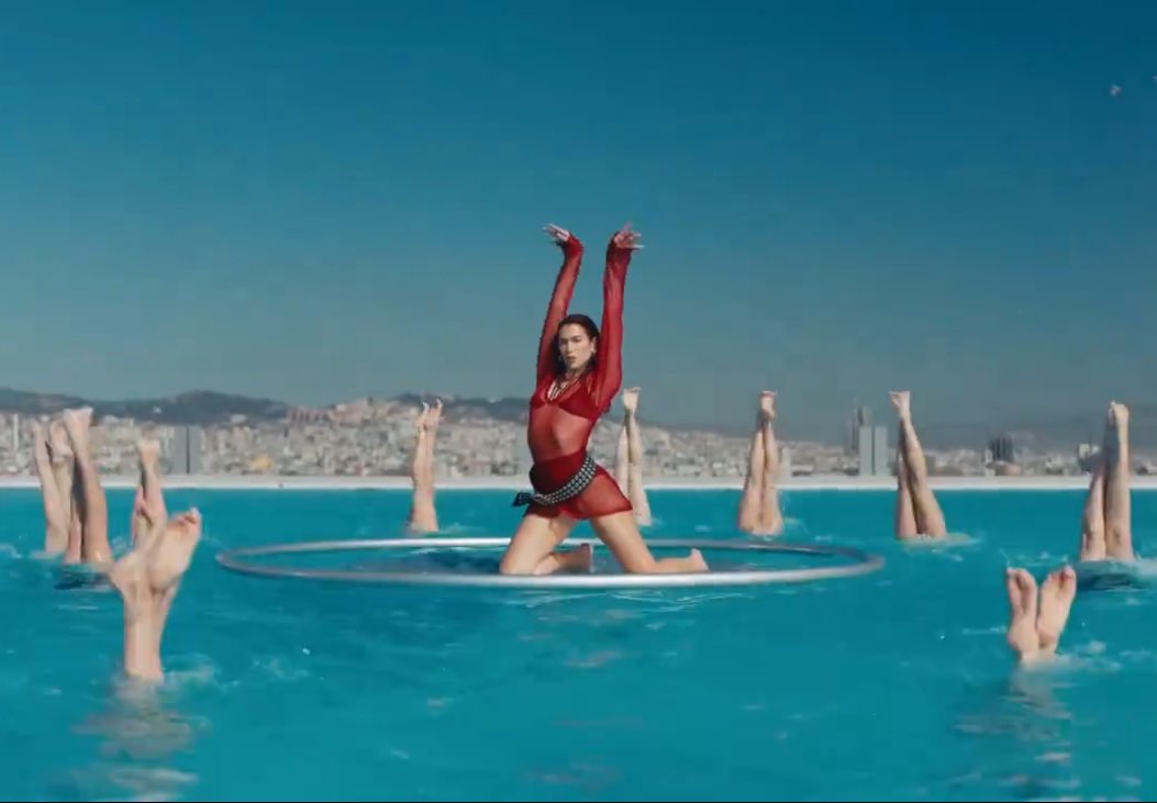 the dress, the swimmers, the city in background, the pose… ART