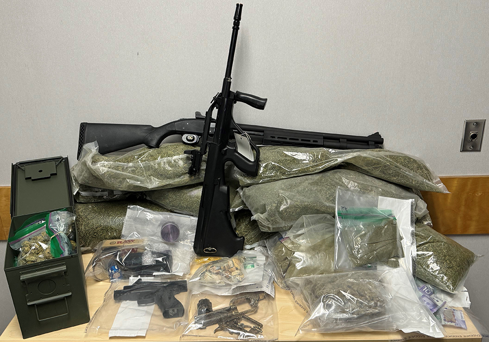 Lac du Bonnet #rcmpmb seized shotgun w/ammunition, replica firearms, large amount of illicit cannabis, psilocybin & drug trafficking paraphernalia from residence in the community. 34yo male with 10-year firearm prohibition arrested as well as 20yo male. Investigation continues.