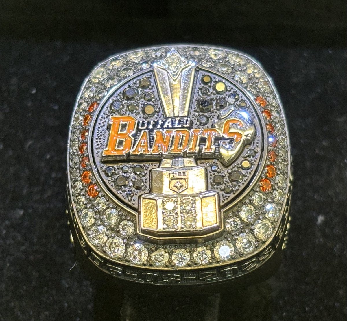 amherstmenslax's tweet photo. What a treat ! Buffalo Bandits trainer and Amherst Lacrosse Alum M. Maisano paid his old coach and Alma Mater a visit today.  With his CHAMPIONSHIP RING! So awesome to get to see him and share some old memories while getting to hold the ring!  Thank you #4!
⁦⁦@WNY_Lax⁩ https://t.co/M0zbvE47g7