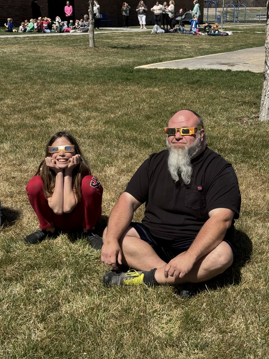 Avielle and her dad enjoying the solar eclipse.
