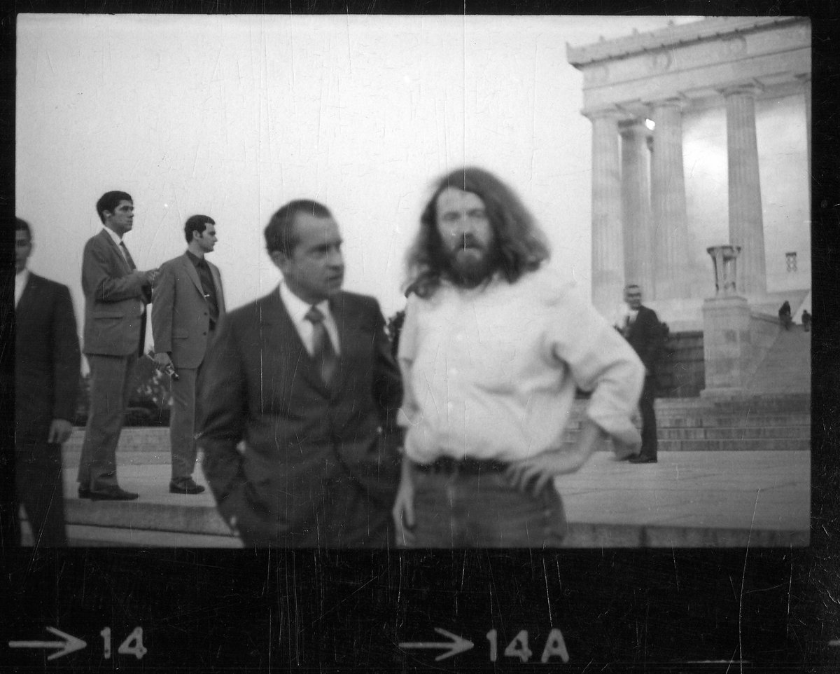 This is probably my favorite picture in American History, the Hippie was on LSD and for years believed he had hallucinated his whole encounter with Richard Nixon around 6AM that morning.