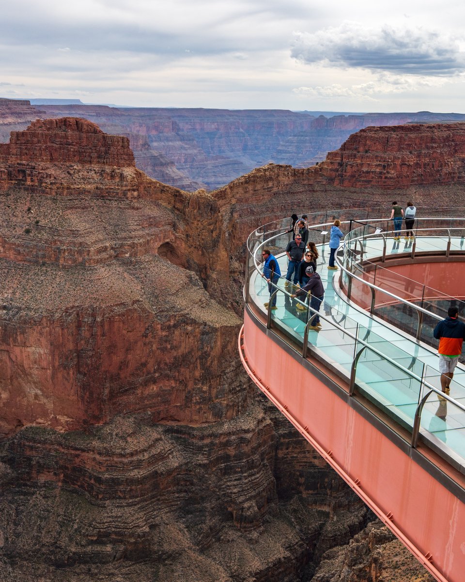 The Grand Canyon Skywalk sits 4,000 feet above the canyon floor, extending 70 feet out over the edge. Would you take a walk on this glass bridge? 🤔 #GrandCanyon