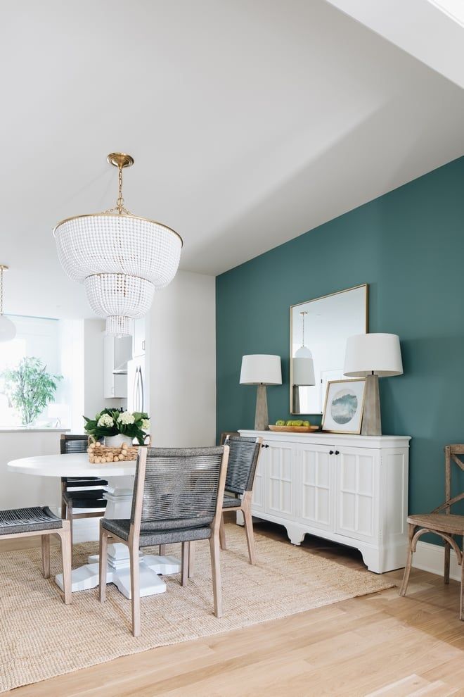 💙💚 Here are my TOP 10 favorite blue-green paint colors to bring a beachy, au natural spa-like vibe into your home 👉 bit.ly/3TybThD - have you tried any of these shades?? 📸 credits: @timbertrailshomes (dining room) @caitlincreerinterior (sitting room)