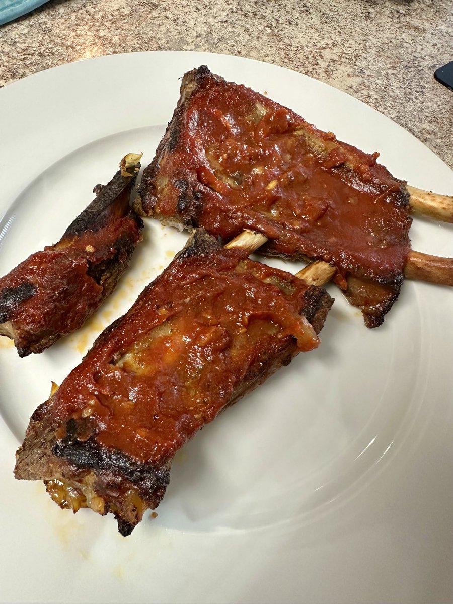 Country style ribs slow cooked all day and finished with my homemade maple bourbon bbq sauce (with a kick) Falling off the bone ❤️