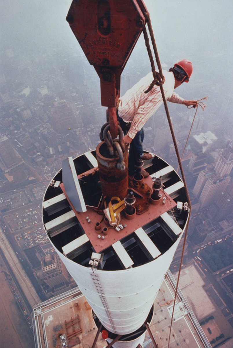 The antenna for the original World Trade Center's North Tower under constuction | 1979