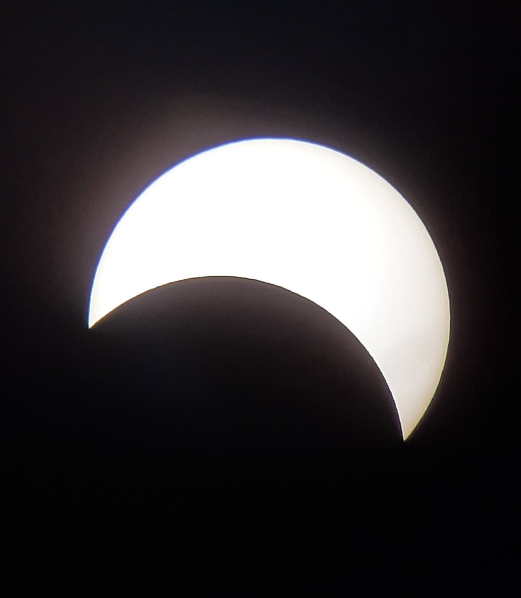 Diana Hews, Prof. Emerita @ Indiana State (staying at the Reserve) took several photos of the partial solar eclipse w. her cell phone through two telescopes set up at the Park Visitor Center. The red photo was taken w. a filter allowing only hydrogen alpha through.