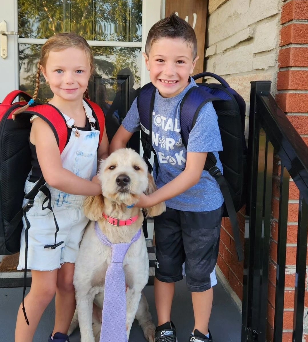 It's #NationalKidsAndPetsDay The cuties below are #AjaxFire Fire Chief’s kids Kaelyn and Brayden & their sweet pup Brinley. To help keep children safe while on their way to school, families should review bus and road safety messages throughout the year. 
@TownOfAjax