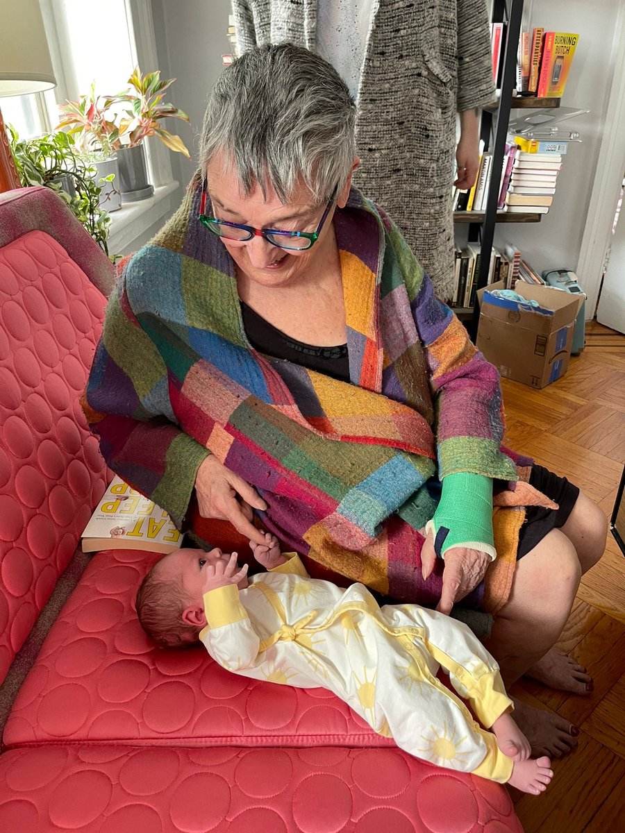 Tough day. Enjoy two very similar photographs of my mother playing with my week-old babbitt, Rocco.