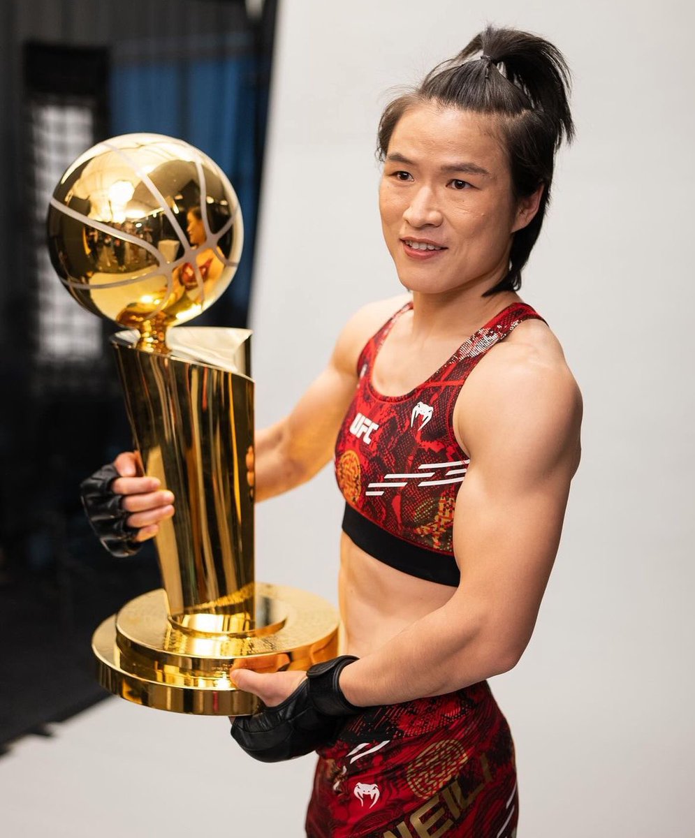 Zhang Weili with the NBA trophy