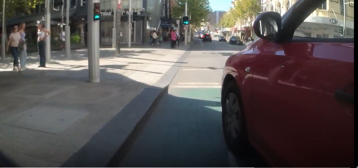 The_Historian's tweet photo. @CityofPerth @BasilZempilas Another case-in-point incident (link to video at bottom of post) that demonstrates why a white line does zero to protect vulnerable road users (bikes, e-bikes and scooters). Riding north up Barrack Street early yesterday afternoon & I very nearly got cleaned up by the red Hyundai when he decided to cut into the bike lane so as not to be delayed by a turning car.  
I can guarantee that with properly separated lanes (like on Roe St) far, far more will ride in the city which is great for business & will mean less congestion.  
(apologies for the colourful language - adrenaline levels were understandably very high!)  

PS: Plenty of other incidents in @CityofPerth are logged by others on the Upride website.   

#perthbetterbybike #perth #RoadSafety

https://t.co/BK7gTbF9kD