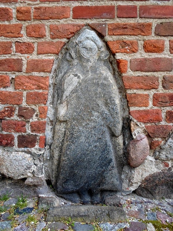 An ancient relief of a human figure (a Slavonic deity?) set into the wall at the entrance of the Marienkirche (St Mary's Church) Bergen, #FolkloreThursday More 1/