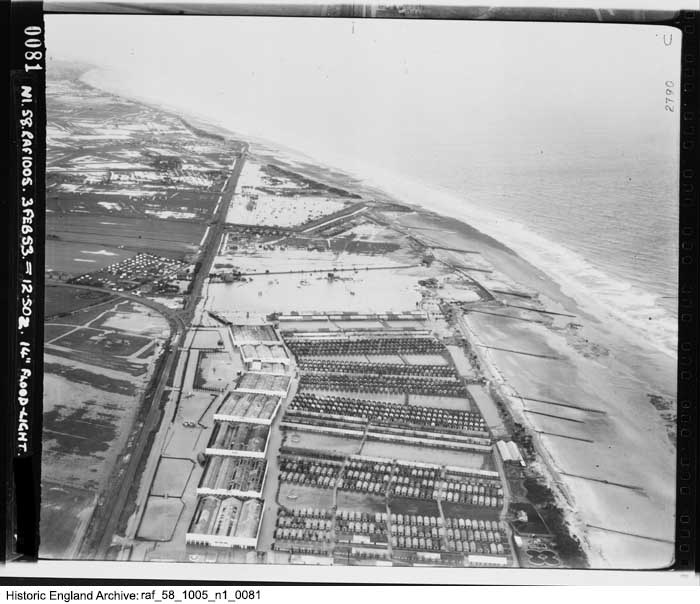 Butlin's Skegness holiday camp opened #OnThisDay in 1936. Today's image from the Historic England Archive dramatically shows the camp following the North Sea Flood of 1953. What can you discover using our Aerial Photo Explorer?👇 historicengland.org.uk/images-books/a… #Butlins