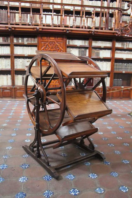 This is a 300-year-old book wheel kept in the Biblioteca Palafoxiana, Puebla, Mexico: it allowed 18th century researchers to have up to seven books open at once. A kind of analog of today's multi-tab browsers.