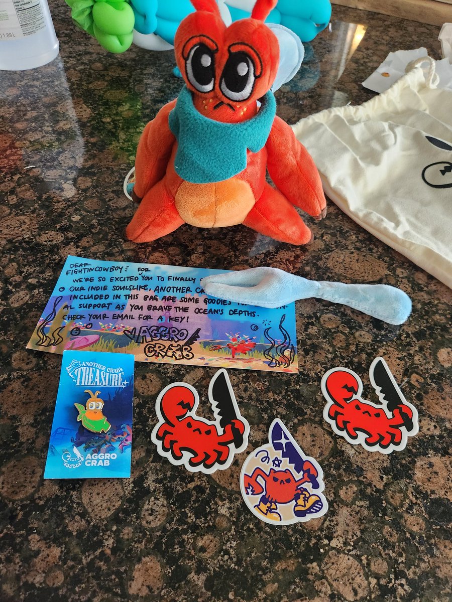 Cute care package from the @AggroCrabGames folks. I'm sure my kids are going to steal the plushie but I'll be able to enjoy the game at least!