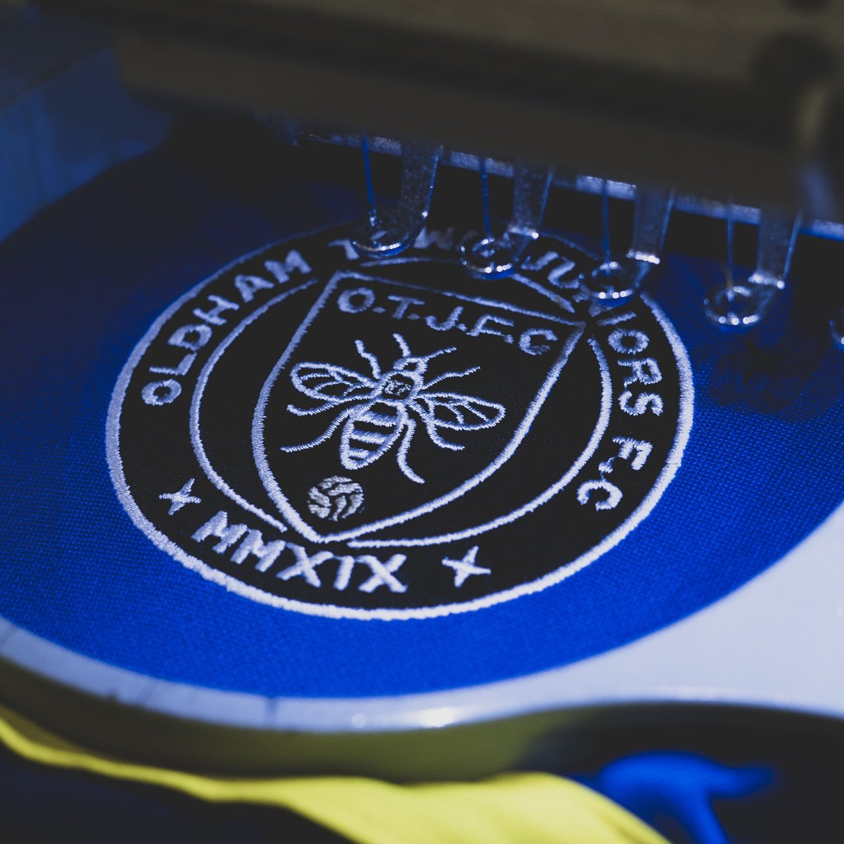 Up close and personal with the Oldham Town Juniors F.C embriodery 🔵🟡 Interested in hearing more about our Navy, Royal and Yellow Leisurewear Range? Contact our team today! 📧 sales@fourexgroup.com 📞 01132526770 🖥 ev2sportswear.com/contact #EV2 | #DesignWithoutLimits