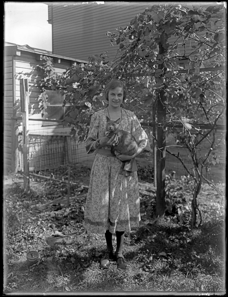 It's #NationalPetDay. Grant Castner photographed his daughter Eleanor in the backyard of the family home with the beloved family pet. Share your pet pic in the comments! (From the exhibition 'Discovering Grant Castner: The Lost Archive of a New Jersey Photographer')