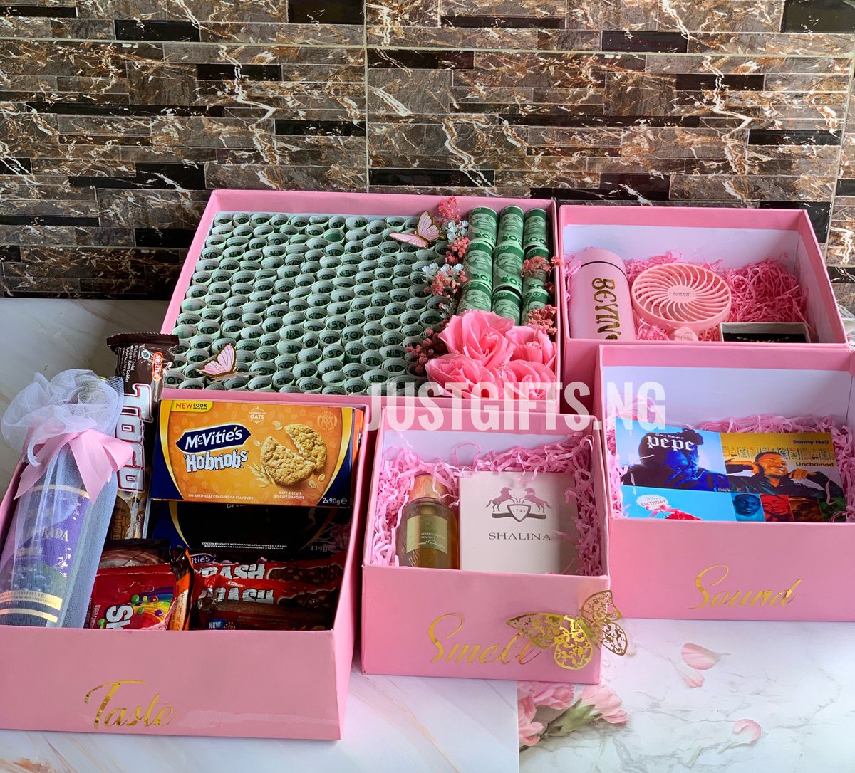 POV: You’re gifted in all 5 senses🥹💗

Smell: Body Mist, Perfume
Touch: Customized water flask, rechargeable fan, Jewelry set
Sound: Personalized Spotify playlist
Taste: Wine, cookies &amp; chocolates
Sight: N100,000 money box

Price: N230,000 
Kindly send a DM to recreate