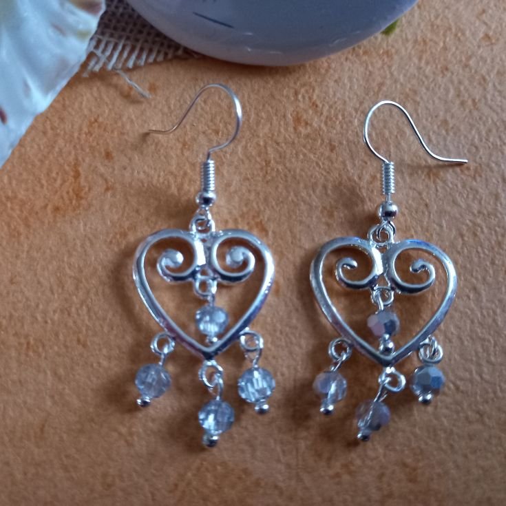 New silver chandelier heart earrings! Each heart has 4 hanging beads.

Available in 4 colourways; Red AB, Black Diamond Shadow, Half Blue Plate and Half Silver Plate.

#SBS #HandmadeInUK #ShopIndie #CraftBizParty #UKMakers #RTUKSeller #UKGiftAm #UKGiftHour #ElevensesHour