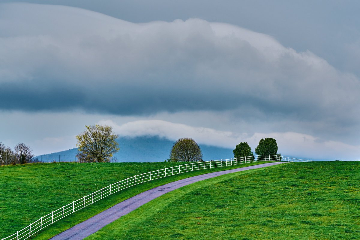 This 'Cloud Over Peaks Knob' was taken from Exit 94 along Interstate 81 in Virginia. Peaks Knob is the large mountain along I-81 at the Pulaski Exit 94. #photography #fineartphotography #landscapephotography #clouds #mountain #fence #spring #Virginia #Pulaski
