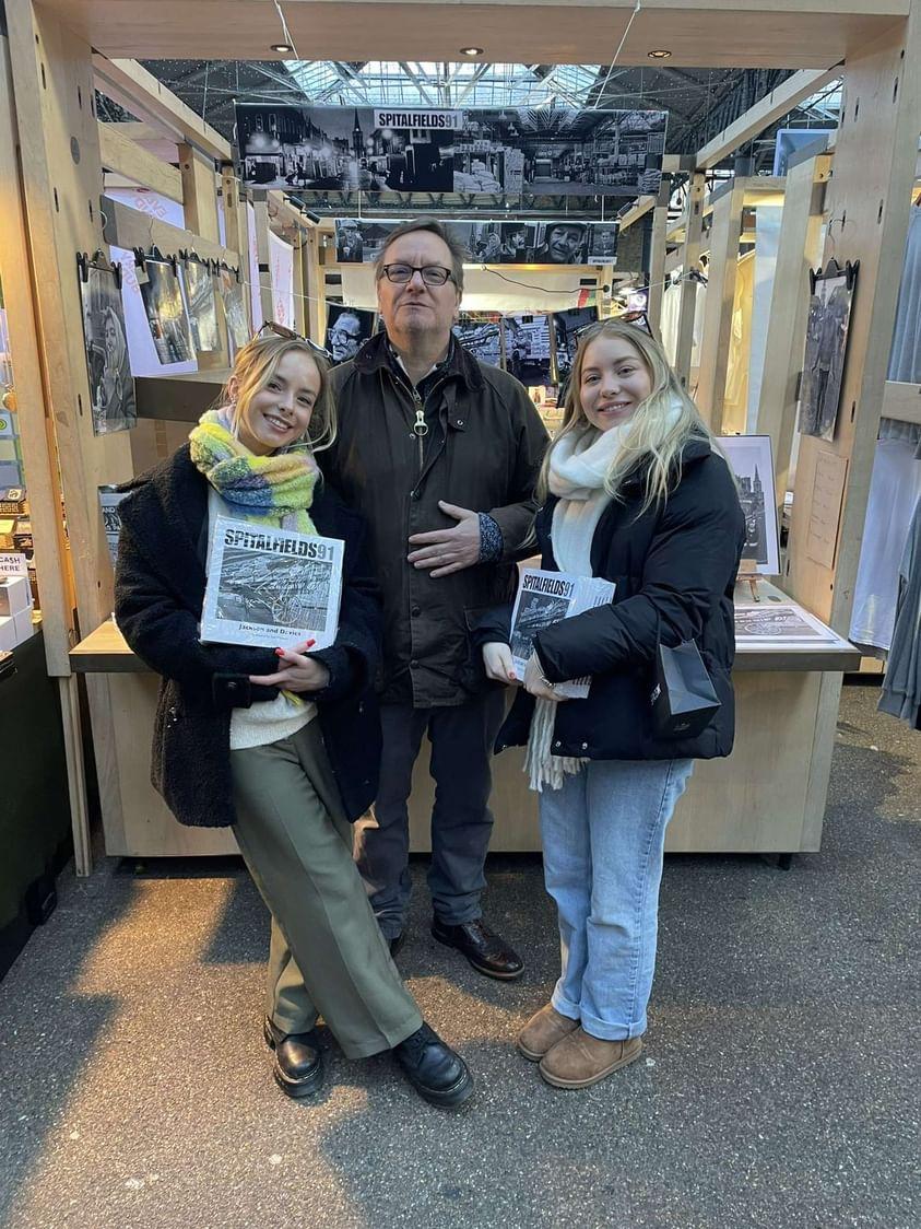 Co-creator of Spitalfields91, Huw Davies pictured with his daughters Rhiannon and Romilly @oldspitalfieldsmarket after the books launch @funkycellar. Spitalfields91 is available at @bricklanebookshop and @funkycellar. #book #Spitalfields #monochrome #family #stall #Bricklane