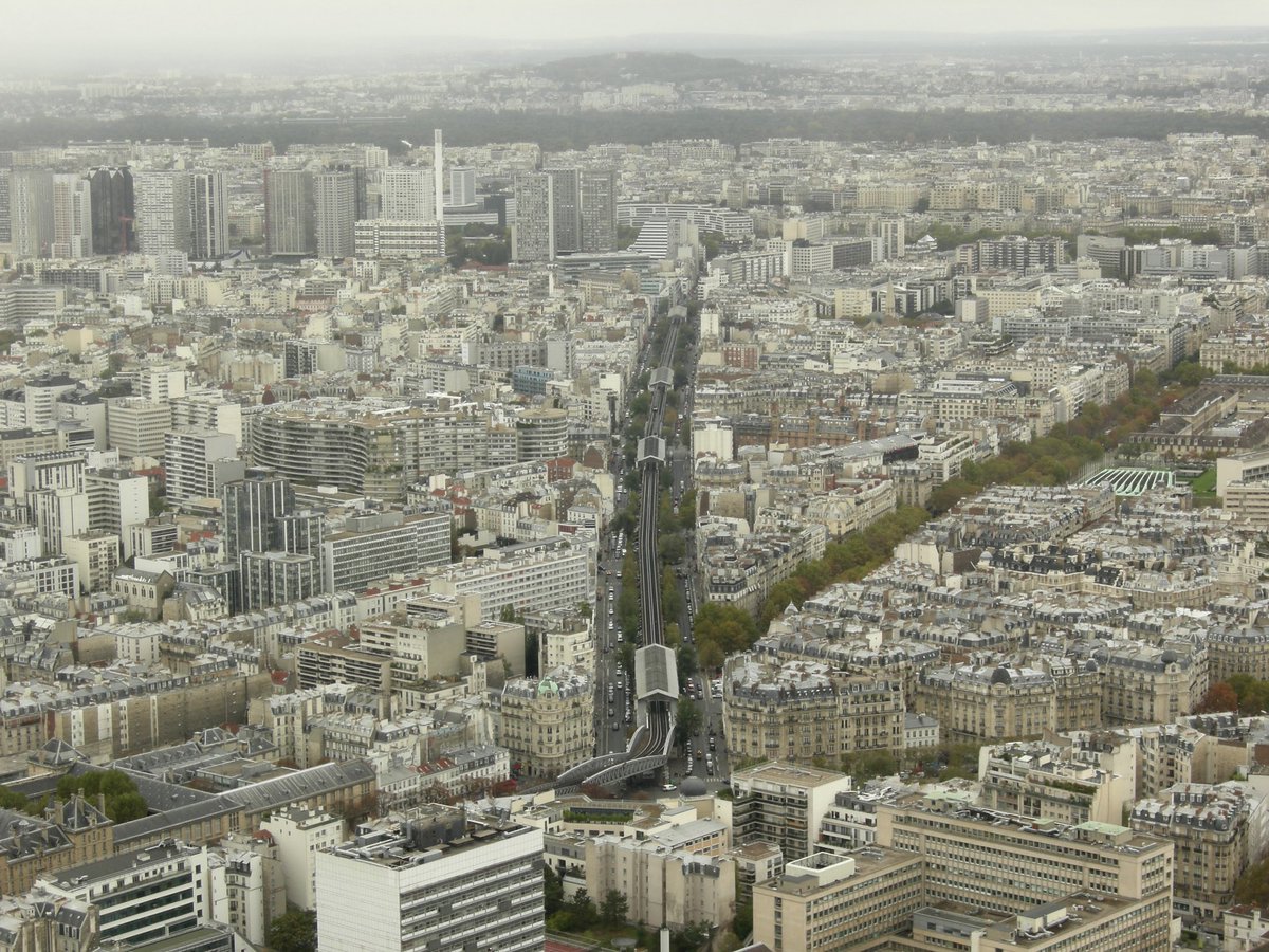 Paris, a view from the top of Montparnasse tower. In the middle, part of the outdoor section of the Metro, line 6. My photo 2011.
