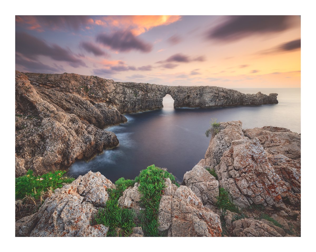 Such an incredible scene unfolding off the coast of Spain! For a bit of scale, if you zoom in you can just make out a person standing atop the arch.