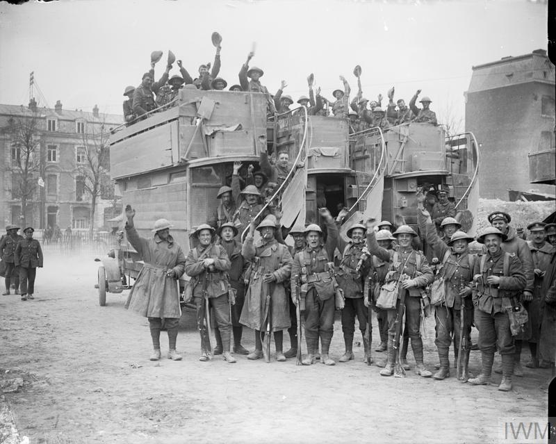 Cheerful British troops board London omnibuses at Arras on their return from the capture of Monchy-le-Preux, 11 April 1917. The photo was taken during the Battle of Arras, which you can read about on our website: bit.ly/42op9rT © IWM (Q 6228)