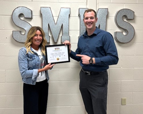 Great job, @RocktonSchools! Counselor Beth DeVries and Principal Justin Bonne of Stephen Mack Middle School accept a commendation certificate for their #SEL work with #Area2SELHub! #WTG, SMMS Team! #ROE4learning #importantwork #traumaresponsiveThursday @AllisonPierson4