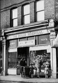 Used to walk past this everyday in Dawes Road, Fulham. Fascinated, I would gaze through the window at the gents at their benches fixing dolls. Can't find a picture more recent than this but eventually it had 'The World Famous Doll's Hospital' on the sign.