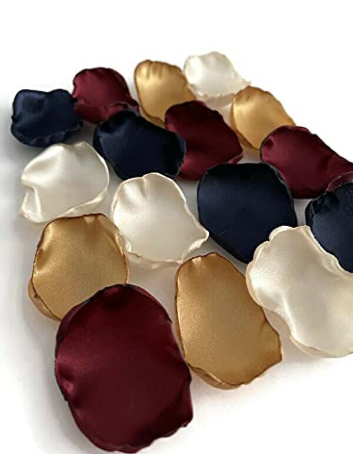 Set the mood for your special day with our Navy Blue, Ivory, Wine, and Gold mixed satin flower petals. Perfect for wedding decor, these… dlvr.it/T5MyFP #weddings #bridalshower #weddingaisledecor #loveislove #microwedding #groomtobe2025 #weddingplanner #smallwedding