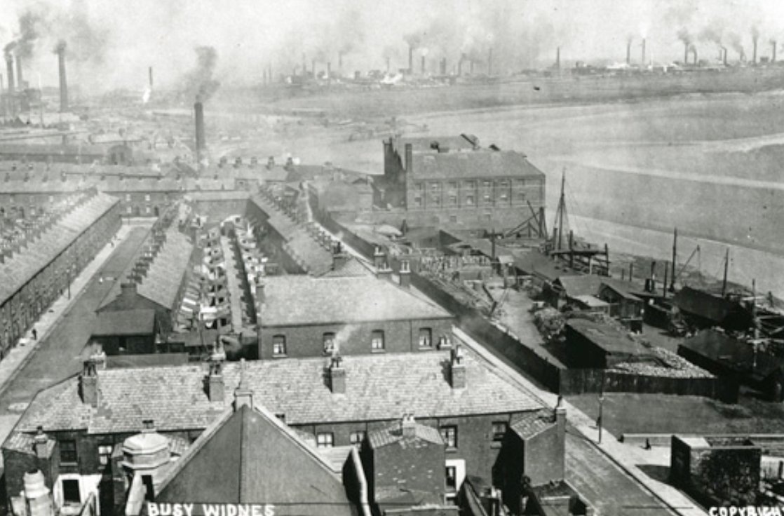 View from roof of St Mary's Church across West Bank. The building centre bottom is the Britannia Inn, to the right is Cooper's pop works. The large building on the river bank is Fairclough's Flour Mill demolished early 1960s. Behind the chimney is the Sankey Canal & Widnes Dock