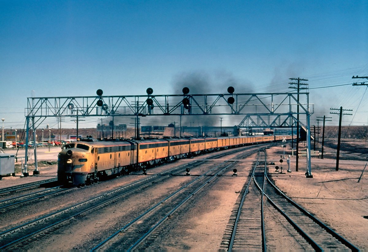 Union Pacific E8A #941 leads the combined City Of Los Angeles/City Of San Francisco westbound out of Cheyenne, Wyoming, circa 1968. This particular locomotive was later sold to the Rock Island the following year. american-rails.com/cyla.html