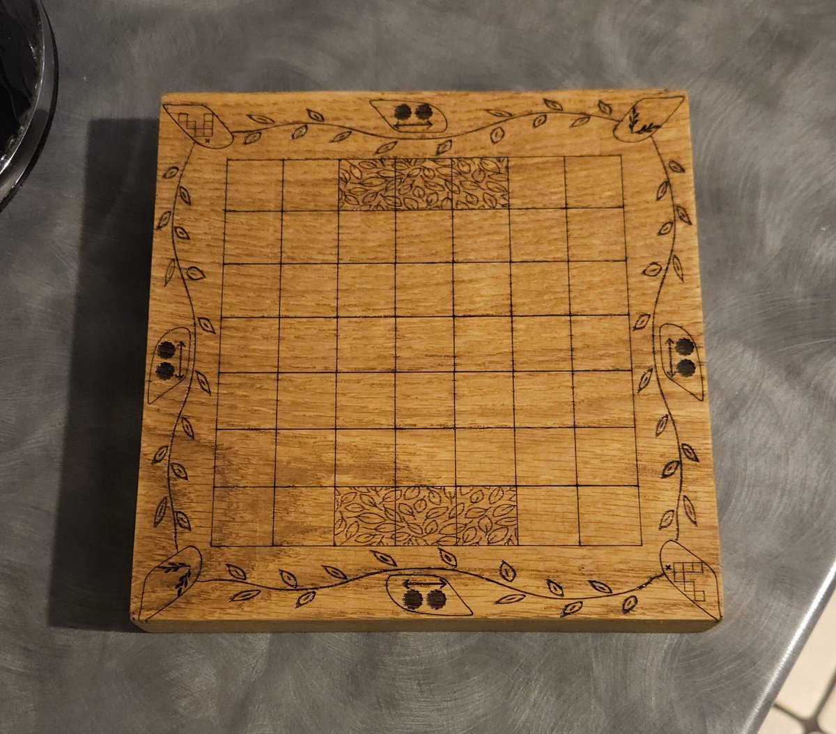 From prototype to almost finished project. We've been working hard on this game. The final board is varnished Oak. All made in the UK called Overgrowth an abstract 2 player game of spreading across a meadow. Who would like to give it a try?