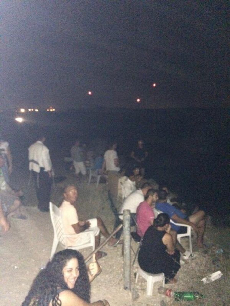 Never forget the 'Sderot Cinema.' Eight years ago, this image captured Israelis gathering to watch nighttime attacks on Gaza. #GazaGenocide