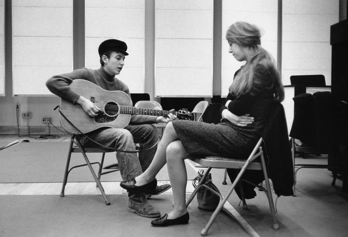 Bob Dylan plays for his girlfriend Suze Rotolo during sessions for his first album, NYC, 1961. 📸: Don Hunstein. #BobDylan #Dylan