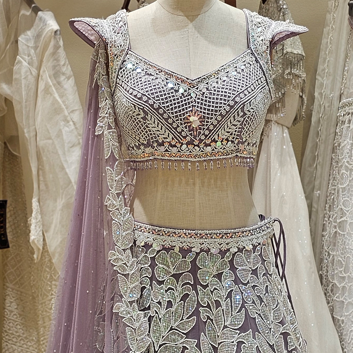 Stone Symphony🌟  Awash in a light purple haze, this lehenga shimmers with stonework, whispering tales of enchantment✨  Make your next event unforgettable. Shop Now! 💫  #neerusindia #neerus #neerusfashion #newcollection #ethnicwear  #lehengas #bridal #gowns #sarees #fusion
