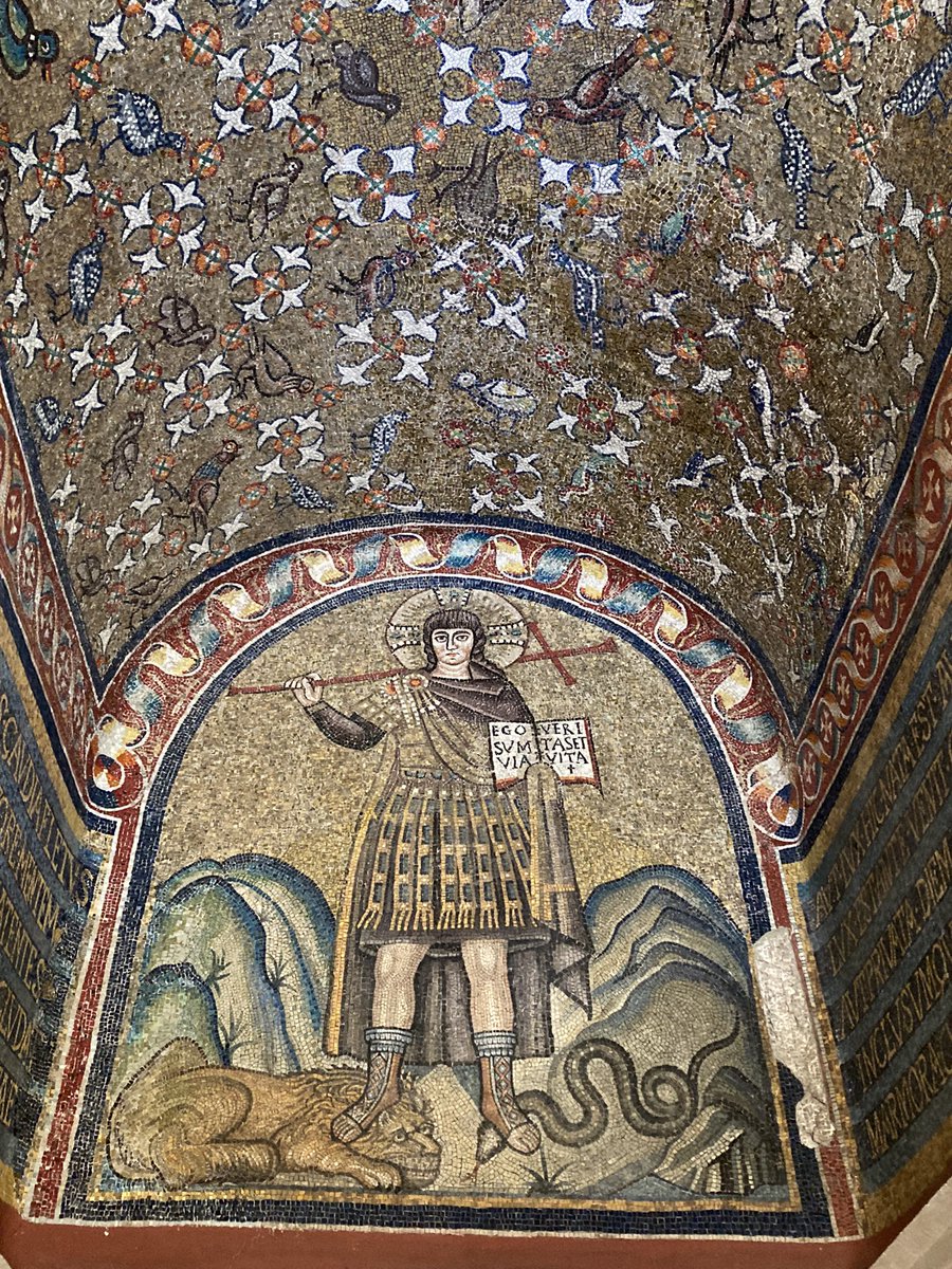 The Archiepiscopal Chapel in Ravenna. Built in the 490s. The earliest surviving depiction of Christ Militant. Christ dressed like a Roman emperor while holding a cross and standing on a lion and snake, representing Satan.