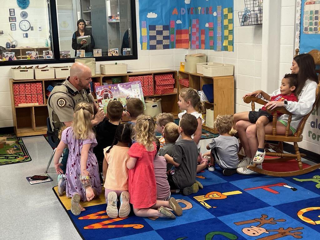 Our School Resource Officer, Investigator Zane Taylor, took some time today to read to the children in our child care program!#SMPantherPride