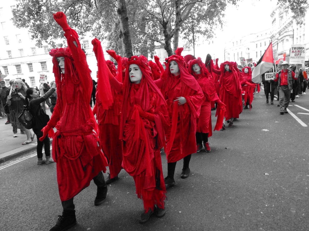 @Gallery365photo #Gallery365in2024Dailyprompt Perturbatio -  The Red Rebel Brigade formed in 2019 by members of Bristol's Invisible Circus for the Extinction Rebellion Spring uprising in 2019 - now with groups in many countries and around the UK