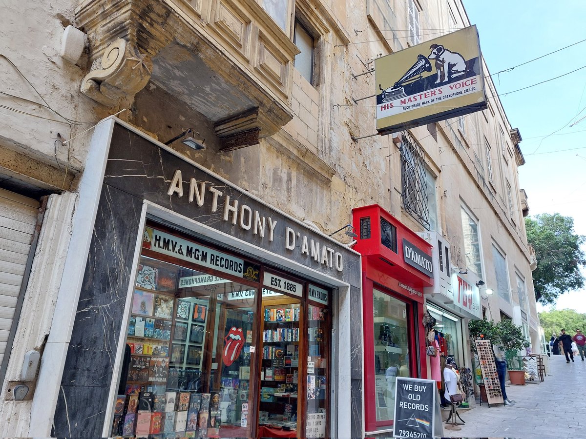 Anthony D'Amato in Valletta, Malta, the world's oldest record shop, from 1885. The old sign with the logo of the Gramophone Company (later HMV) with the dog in front of the gramophone has been hanging there for 60 years