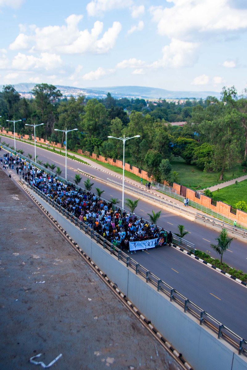 This evening, Rwandans marched for #Kwibuka30 from @IPRCKigali former Eto Kicukiro where @UN forces in 1994 abandoned more than 2000 Tutsis and later killed. It's a walk ahead of the #Kwibuka30 night vigil being held at @NyanzaMemorial. #Kwibuka30 #NyanzaKicukiro