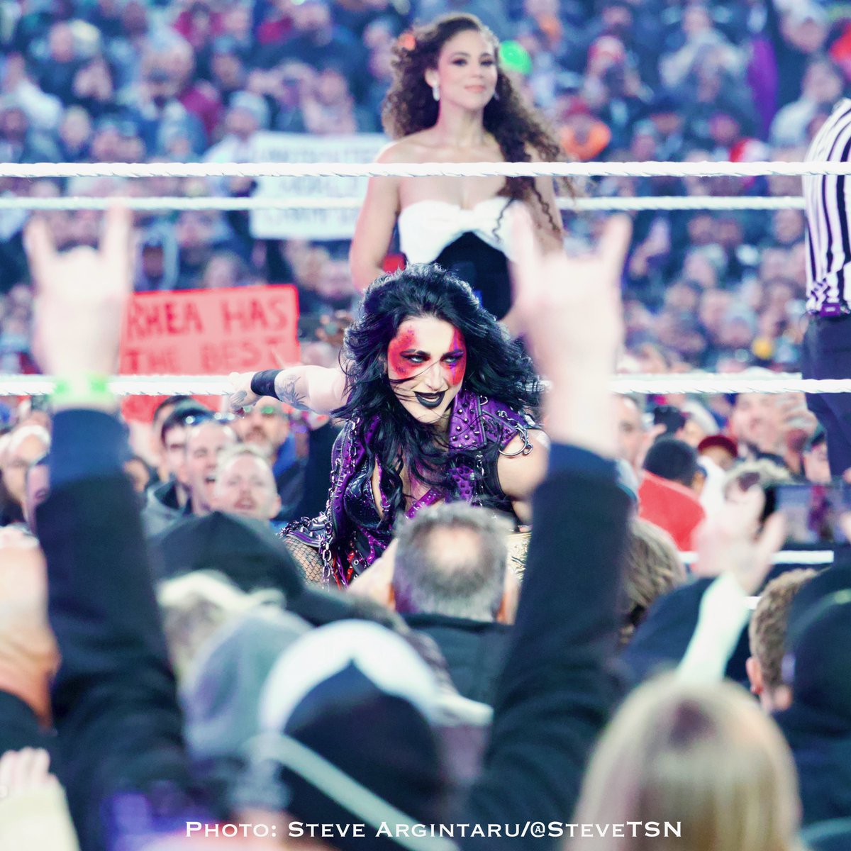 Women’s World Champion Rhea Ripley arrives for the opening match of #WrestleMania, with world champion ring announcer Samantha Irvin looking on.