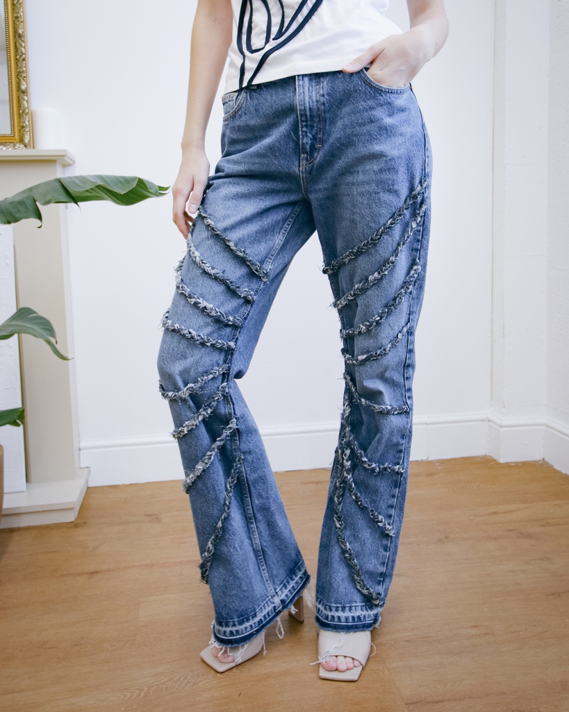 These upcycled denim jeans use scrap denim to create rope braids that drape across the front of the jeans. 👯‍♀️ Shop here: l8r.it/1Sz1 #fanfarelabel #denimlooks #90sfashion #aesthetic #90s #vintage #90saesthetic #fashion #grungeaesthetic #grunge