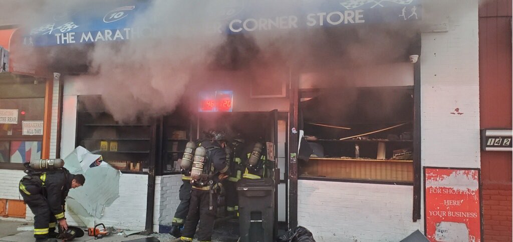 Companies working at the fire at 140 Norfolk St. Dorchester. The fire is in the wall of the store all companies are working.