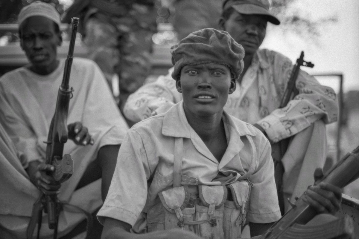 Fighters sitting in the back of a truck — South Sudan