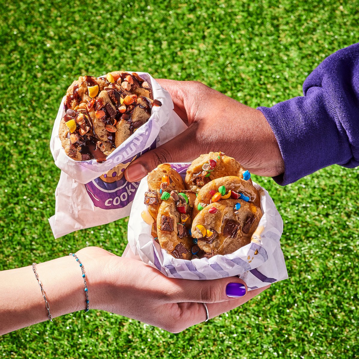 Walking Cookie Tacos are HERE! 12 mini cookies piled high in a portable package with your choice of sweet drizzle + candy topping