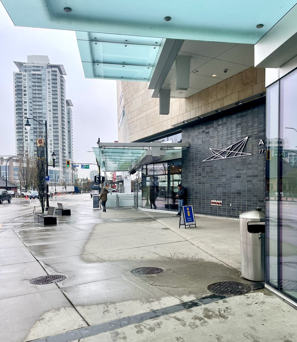 The wet spots on the sidewalk next to this building show how some architect failed to design a building that could have had continuous weather protection for pedestrians walking along the building frontage. It would have been easy to overlap canopies. #architecture #urbandesign