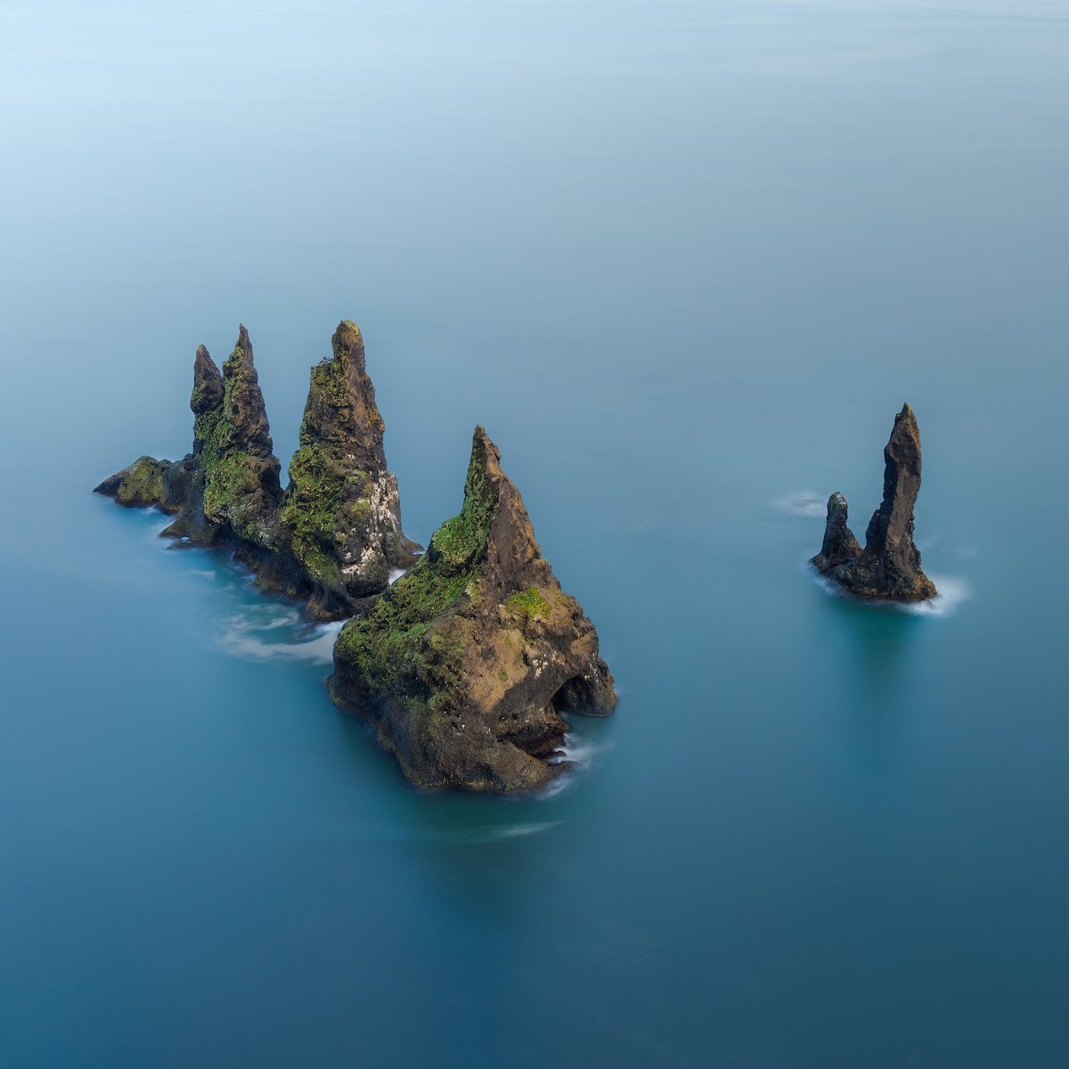 According to legend, the famous Reynisdrangar rock formations in South Iceland are trolls turned to stone! 🧌🧌🪨🪨⁠
⁠
They were caught by the light of the rising sun as they were busy trying to pull a ship onto the shore 🌄⁠

#reynisfjara #blacksandbeach #iceland